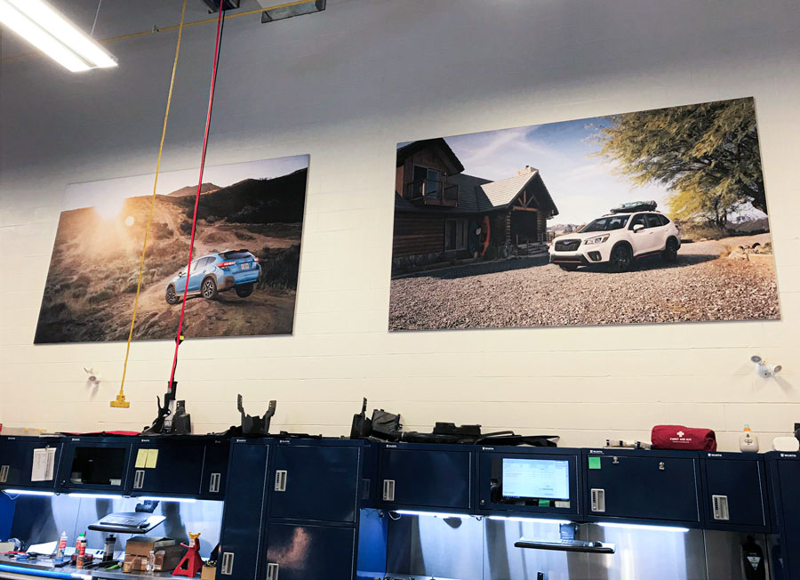 Seamless fabric showroom wall display being installed at a GTA dealership by C17 Media's large format production team