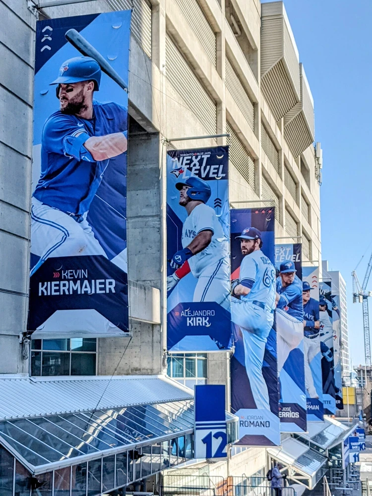 Large-format player banners installed on a Toronto stadium exterior by C17 Media